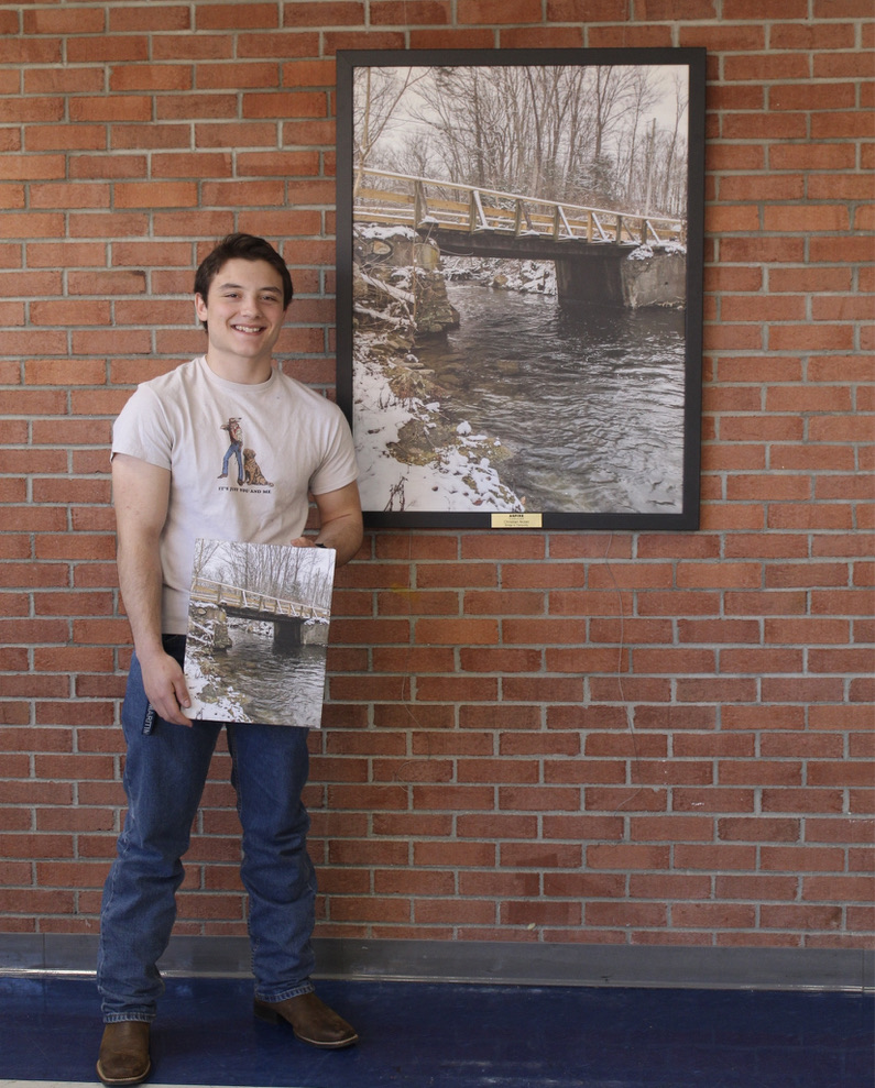 Christian Nolan is honored for his ASPIRE artwork entitled "Bridge to Tranquility."  